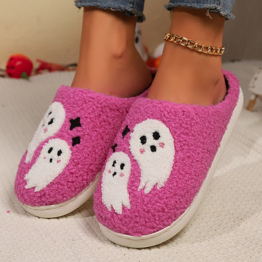 Pink slippers with ghost designs on a neutral background