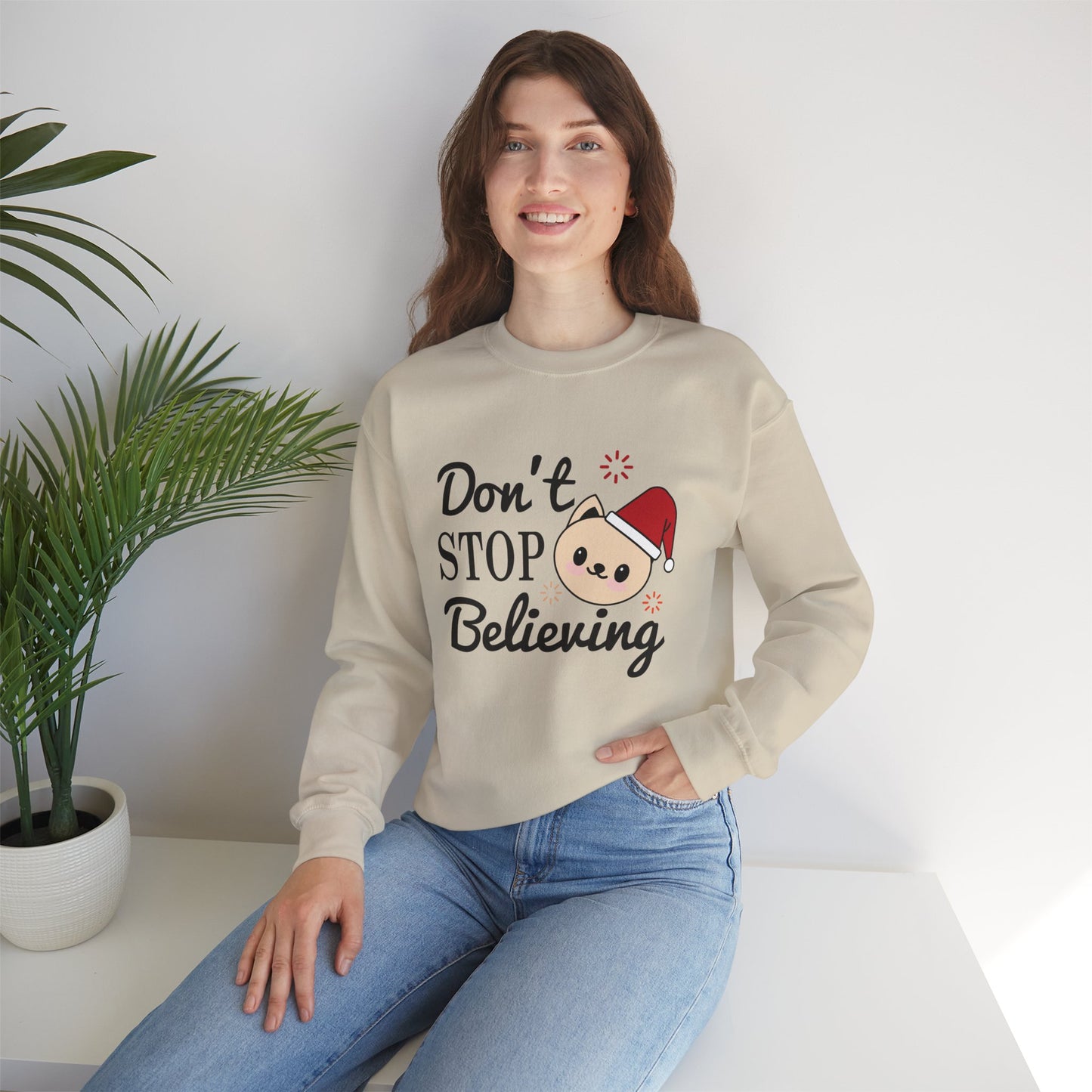 Don’t Stop Believing Christmas Crewneck – Cute Santa Cat Holiday Sweatshirt (Unisex)