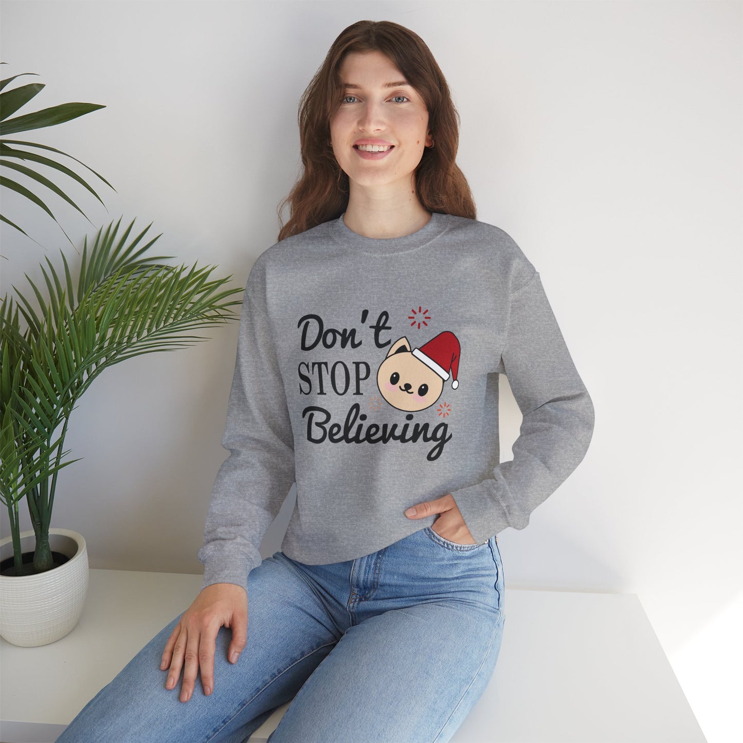 Don’t Stop Believing Christmas Crewneck – Cute Santa Cat Holiday Sweatshirt (Unisex)