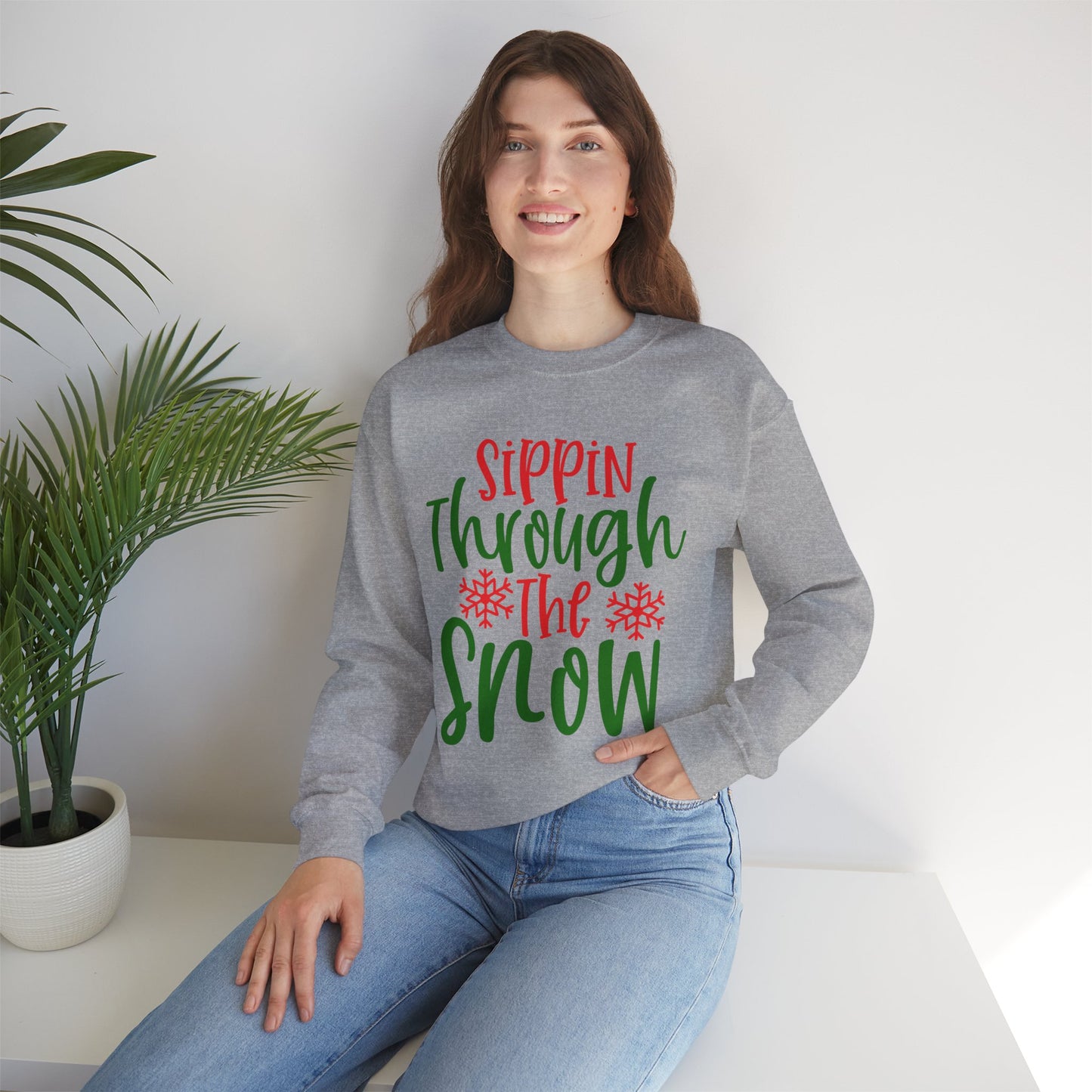 Sippin’ Through The Snow Sweatshirt – Festive Holiday Unisex Heavy Blend Crewneck