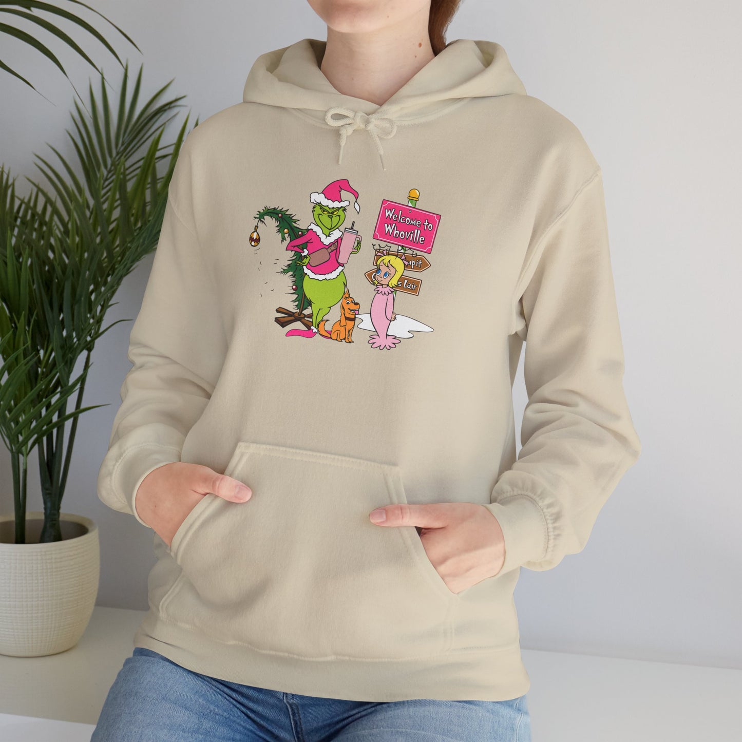 Welcome to Merryville Christmas Hoodie – Cute Green Creature & Winter Village Sweatshirt (Unisex)