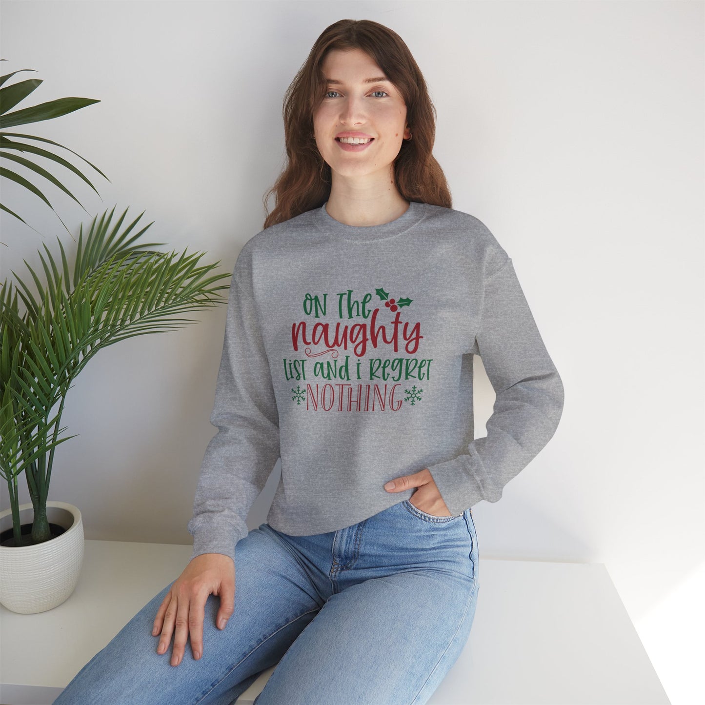 On The Naughty List And I Regret Nothing Unisex Heavy Blend Crewneck Sweatshirt