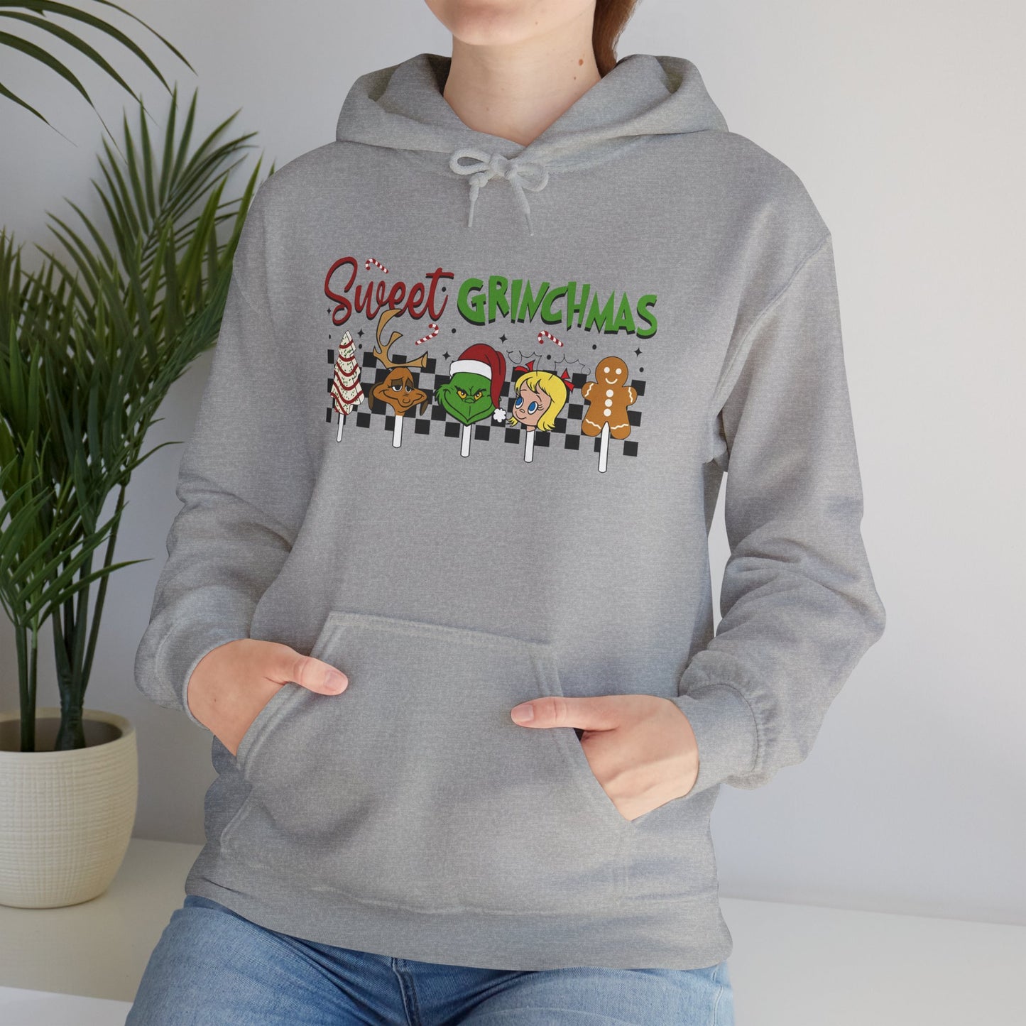 Sweet Grinchmas Candy Characters Funny Christmas Hoodie – Cute Holiday Treats Grinch-Inspired Unisex Heavy Blend Hooded Sweatshirt