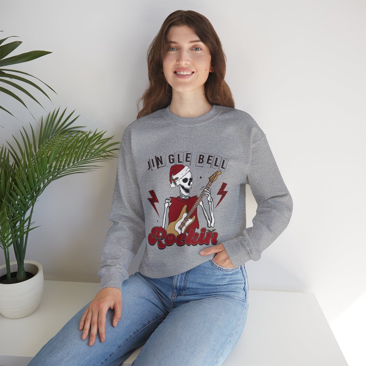 Jingle Bell Rockin’ Skeleton Christmas Rock Music Holiday Sweatshirt – Retro Guitar Santa Unisex Heavy Blend Crewneck