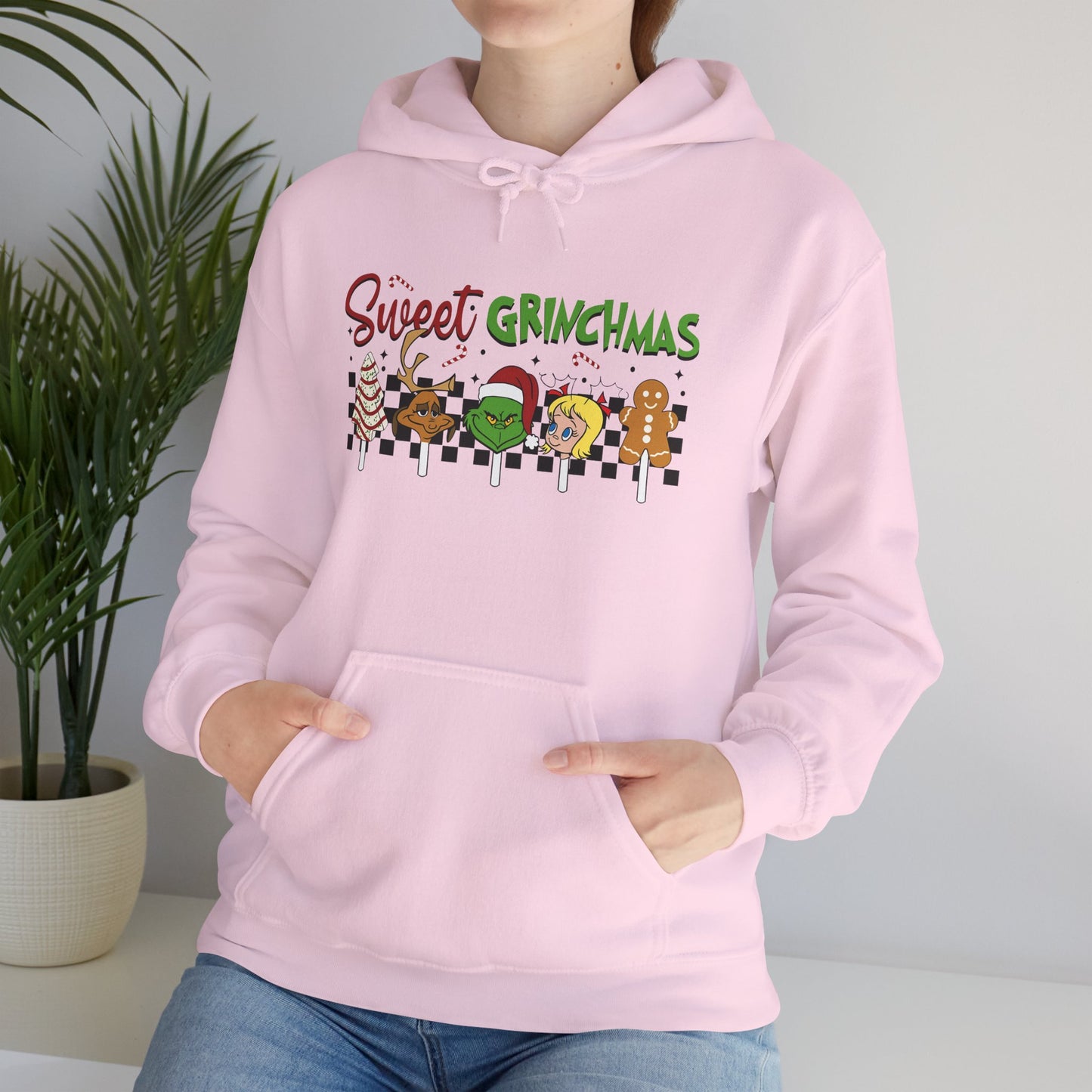 Sweet Grinchmas Candy Characters Funny Christmas Hoodie – Cute Holiday Treats Grinch-Inspired Unisex Heavy Blend Hooded Sweatshirt