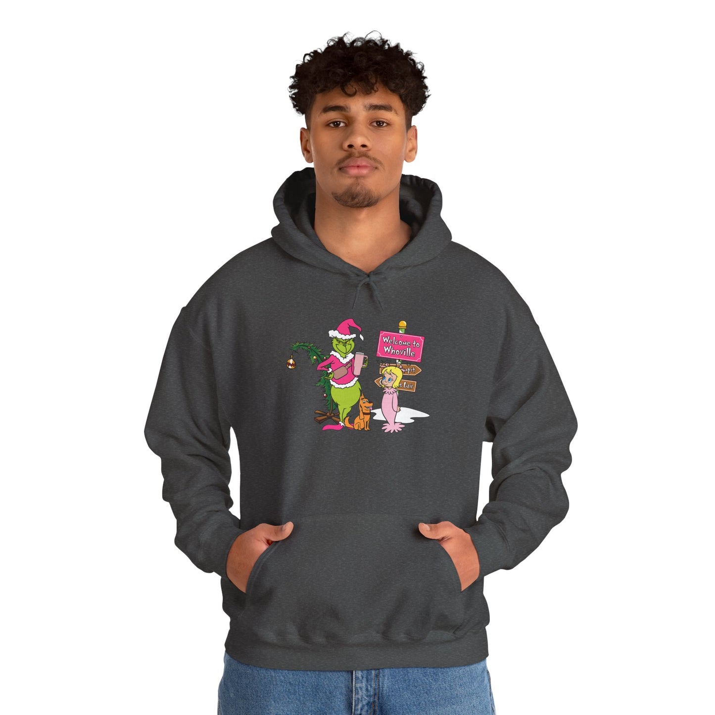 Welcome to Merryville Christmas Hoodie – Cute Green Creature & Winter Village Sweatshirt (Unisex)