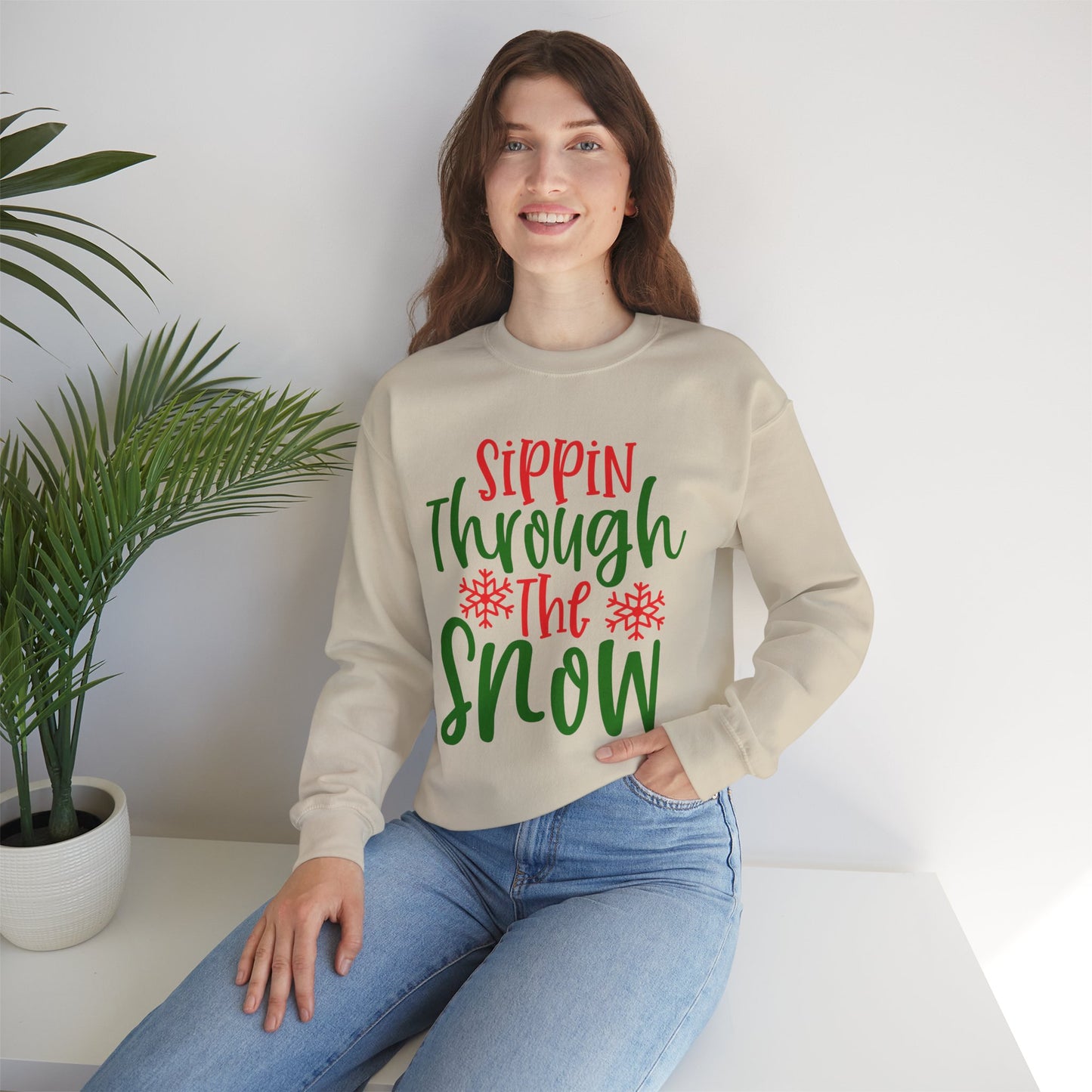 Sippin’ Through The Snow Sweatshirt – Festive Holiday Unisex Heavy Blend Crewneck