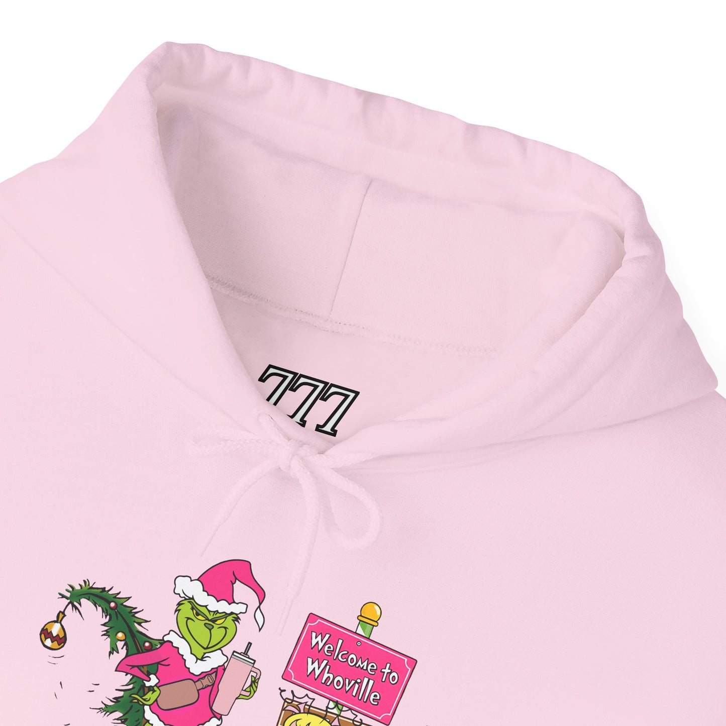 Welcome to Merryville Christmas Hoodie – Cute Green Creature & Winter Village Sweatshirt (Unisex)