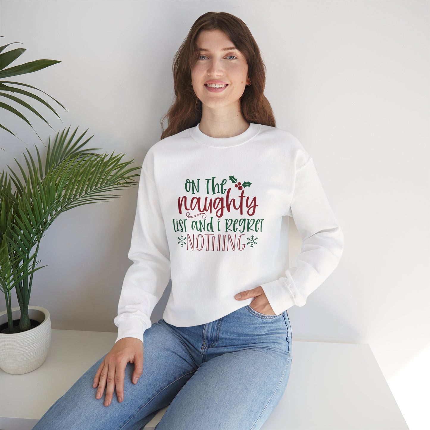 On The Naughty List And I Regret Nothing Unisex Heavy Blend Crewneck Sweatshirt