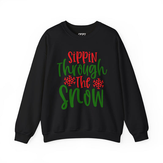 Sippin’ Through The Snow Sweatshirt – Festive Holiday Unisex Heavy Blend Crewneck
