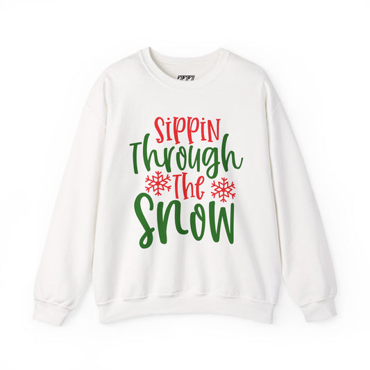 Sippin’ Through The Snow Sweatshirt – Festive Holiday Unisex Heavy Blend Crewneck