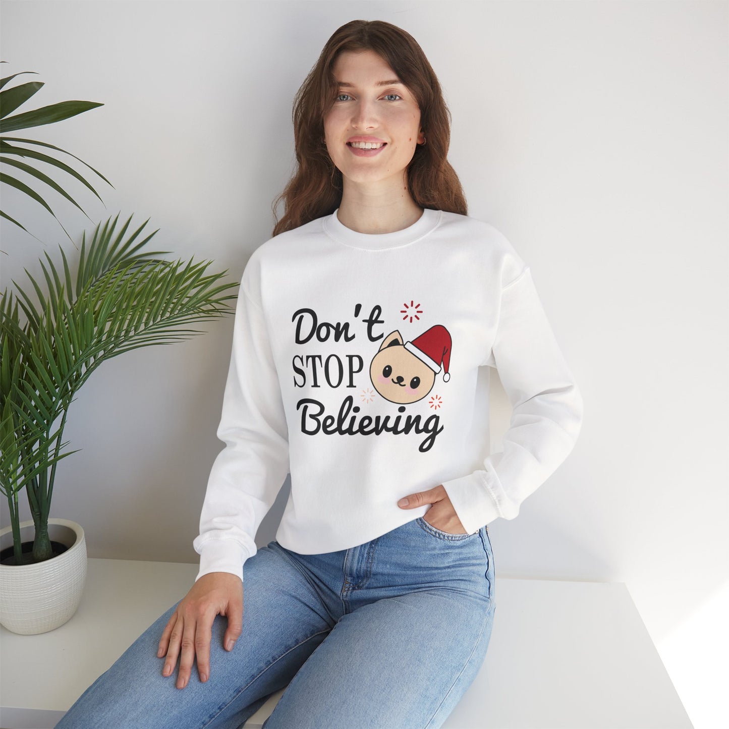 Don’t Stop Believing Christmas Crewneck – Cute Santa Cat Holiday Sweatshirt (Unisex)